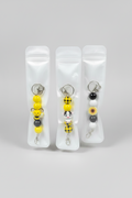 Add a little charm to your everyday essentials with our handmade beaded keychains! Each keychain is carefully handcrafted using high-quality silicone beads and features a fun, unique design that’s perfect for expressing your personality.

Attach it to your keys, purse, backpack, diaper bag, or tote for a cute and stylish accessory that stands out wherever you go.

Features:

🐝 Handmade with premium silicone beads
🔑 Durable keyring and lobster clasp
🎒 Perfect for keys, purses, backpacks, and tote bags
💛 
